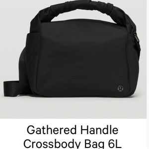 Lululemon black adjustable shoulder bag. Cute scrunched handle.